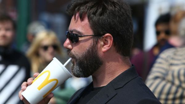 UKIP European Parliament candidate Carl Benjamin, who has had milkshakes thrown at him at least four times this month, made a show of sipping on a McDonald's milkshake at one of his events this week (AFP Photo