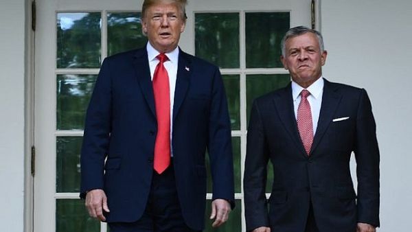 Jordan’s King Abdullah II (R) is greeted by US President Donald Trump at the White House on June 25, 2018. (AFP Photo/Brendan Smialowski)