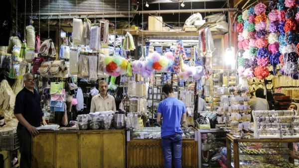 A merchant in al-Hamidiyah Souq /AFP