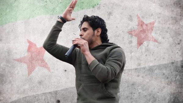 One of the iconic images of Abdelbast Sarout while performing one of his revolution songs. (Twitter)