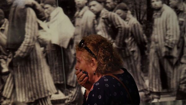 Rachel Sokolovski, the widow of a Holocaust survivor, reacts while viewing photographs at the Los Angeles Museum of the Holocaust in Los Angeles on April 23, 2017.(Mark Ralston/AFP)