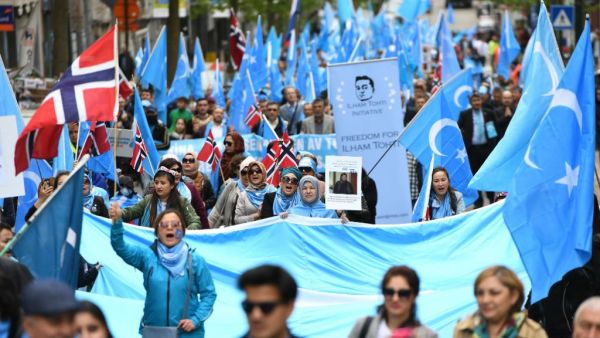 Uyghures marching in Brussels in April 2018 to demand international action to stop China from prosecuting minorities. (AFP)