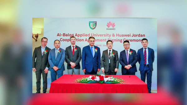 Representatives from Balqaa Applied University and Huawei Jordan pose for a photo during a signing ceremony in Shenzhen, China. (PETRA)