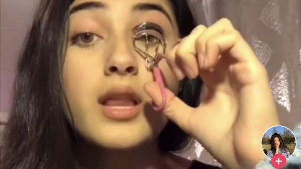 Teenager Feroza Aziz begins the TikTok video with an eyelash curler in hand, but then shifts attention to a serious topic - the mass detentions of minority Muslims in north-west China.