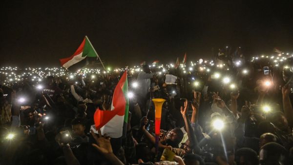 Sudanese protesters open their smartphones lights during a protest outside the army headquarters in the capital Khartoum on April 21, 2019. (AFP/ File Photo)