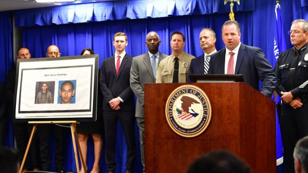 FBI Special Agent in Charge Ryan Young briefs the media beside photos of a suspect arrested in connection with an alleged terror plot targetting Southern California sites on April 29, 2019 in Los Angeles