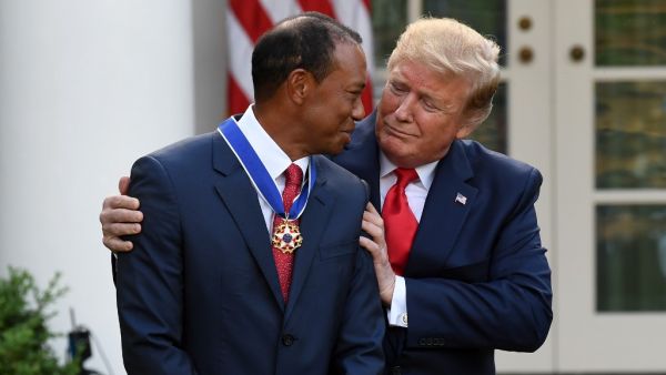 US President Donald Trump presents US golfer Tiger Woods with the Presidential Medal of Freedom during a ceremony in the Rose Garden of the White House in Washington, DC, on May 6, 2019.  (SAUL LOEB / AFP)