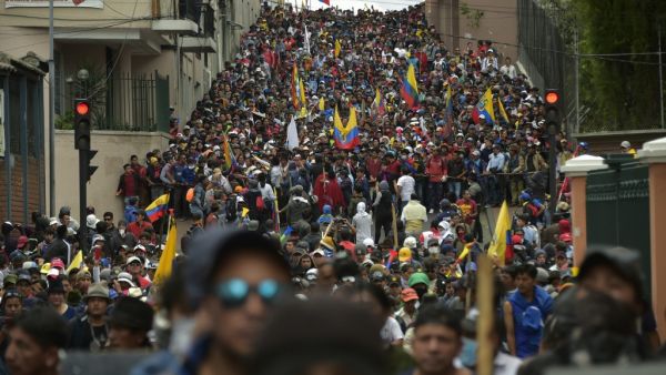 Protesters march against President Lenin Moreno's decision to slash fuel subsidies, in Quito on October 9, 2019. Unions and other groups alongside thousands of farmers and indigenous people are expected in the streets of the capital Quito. 