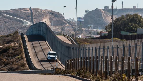 Border Patrol vehicle patrolling along the fence of the international border between San Diego, California and Tijuana, Mexico. (Shutterstock/ File Photo)