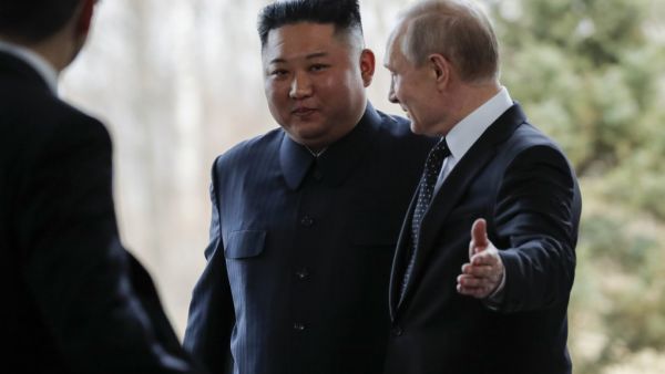 Russian President Vladimir Putin welcomes North Korean leader Kim Jong Un prior to their talks at the Far Eastern Federal University campus on Russky island in the far-eastern Russian port of Vladivostok on April 25, 2019.  (Alexander Zemlianichenko / POOL / AFP)