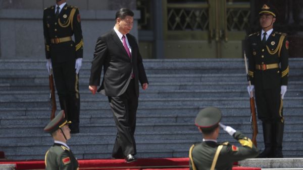China's President Xi Jinping (C) arrives to attend a welcoming ceremony for Mongolia's President Khaltmaagiin Battulga (not pictured) at the Great Hall of People in Beijing on April 25, 2019. (AFP)