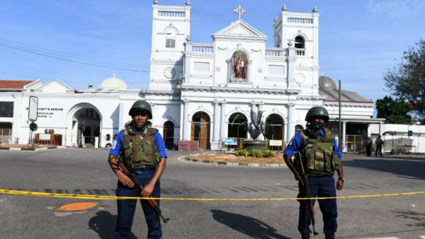 Sri Lankan security personnel stand guard in front of St Anthony's Shrine two days after it was attacked as part of a string of suicide bomb attacks on churches and hotels, in Colombo on April 23, 2019. (Lakruwan Wanniarachchi, AFP )