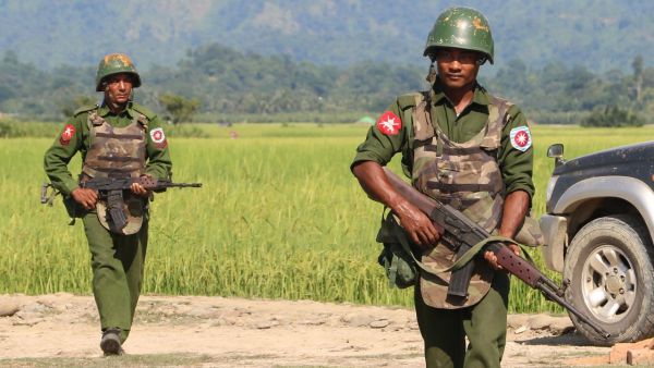 Myanmar army soldiers patrolling a village in Maungdaw located in Rakhine State. (AFP)