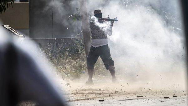 A fighter loyal to the internationally recognised Government of National Accord (GNA) fires a rocket-propelled grenade during clashes with forces loyal to strongman Khalifa Haftar. (AFP/ File Photo)