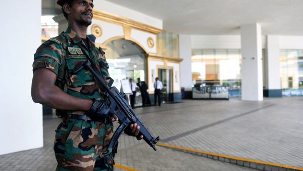 Sri Lankan soldier stands guard at the entrance of the Cinnamon Grand hotel lobby in Colombo. (AFP/ File Photo)