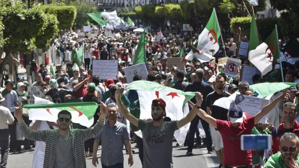 Algerian protesters march with national flags during an anti-government demonstration in the capital Algiers on May 10, 2019. (AFP)
