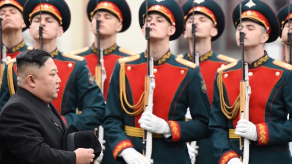 North Korean leader Kim Jong Un walks past honour guards during a welcoming ceremony upon arrival at the railway station in the far-eastern Russian port of Vladivostok on April 24, 2019. (Kirill KUDRYAVTSEV / AFP)