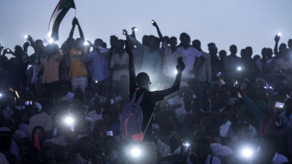 Sudanese protesters open their smartphones lights as they gather for a "million-strong" march outside the army headquarters in the capital Khartoum on April 25, 2019. (AFP/ File Photo)