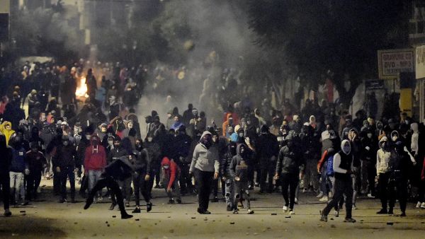 Tunisian protesters take to the streets against corruption, police repression, and neoliberal reforms (AFP/FILE)