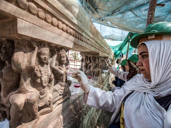 Archaeologists work on restoring relief sculptures at the historic "Le Palais Hindou" (also known as the "Baron Empain Palace") built by in the early 20th century by Belgian industrialist Edouard Louis Joseph, Baron Empain, in the classical Khmer architectural style of Cambodia's Angkor Wat, in the Egyptian capital Cairo's northeastern Heliopolis district on August 18, 2019.  Khaled DESOUKI / AFP