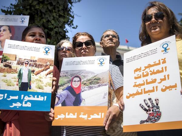 Demonstrators hold up signs showing the portraits of Hajar Raissouni, a Morrocan journalist of the daily newspaper Akhbar El-Youm, with captions reading in Arabic (L to R) "Free Hajar", "Freedom for Hajar", "No to the criminalisation of consensual relations between adults", as they gather outside a courthouse holding her trial on charges of abortion in the capital Rabat on September 9, 2019. FADEL SENNA / AFP