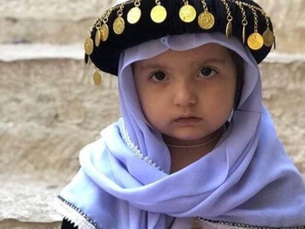 Photo of little Yezidi child in Yezidi traditional clothes in Lalish Temple the holiest Yezidi Religious Site in the world (Twitter)