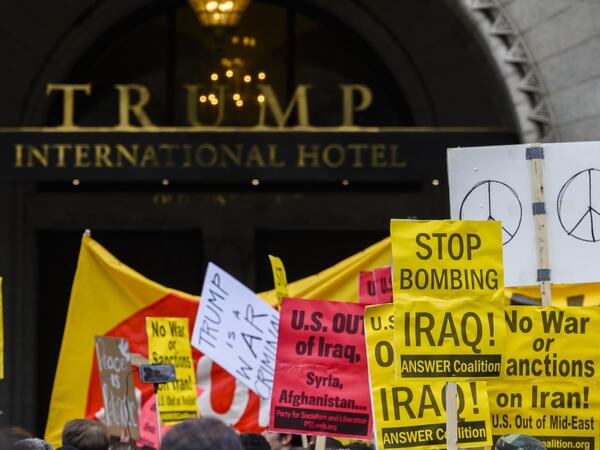 Anti-war activist demonstrate outside the Trump International Hotel in Washington, DC, on January 4, 2020. Demonstrators are protesting the US drone attack which killed Iran's Major General Qasem Soleimani in Iraq on January 3, a dramatic escalation in spiralling tensions between Iran and the US, which pledged to send thousands more troops to the region. ANDREW CABALLERO-REYNOLDS / AFP