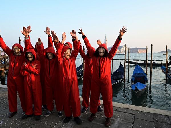 Masked revellers poses in Riva degli Schiavoni during the opening of the Venice Carnival on February 09, 2020. The carnival in Venice takes place until February 25, 2020. Vincenzo PINTO / AFP