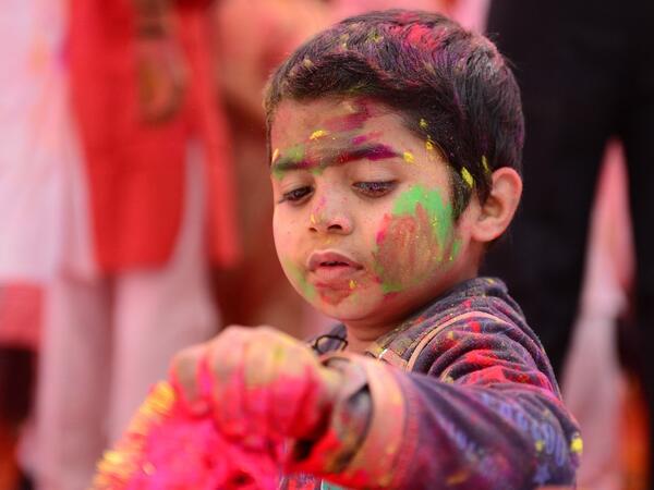 A child suffering from cerebral palsy celebrates Holi, the spring festival of colours, during an event origanized by Trishla Foundation, a non-profit organisation for cerebral palsy treatment, in Allahabad on March 6, 2020. SANJAY KANOJIA / AFP