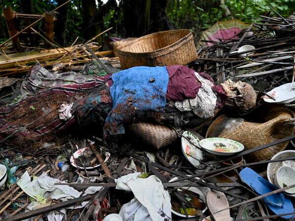 This picture taken on February 20, 2020 shows the body of a deceased at a cemetery where Bali's Trunyanese people hold open-air burials - before restrictions were implemented due to the COVID-19 coronavirus - near the village of Trunyan in Bangli Regency, near Lake Batur on Bali island. For centuries Bali's Trunyanese people have left their dead to decompose in the open air, the bodies placed in bamboo cages until only the skeletons remain -- a ritual they haven't given up -- even as the COVID-19 pandemic u