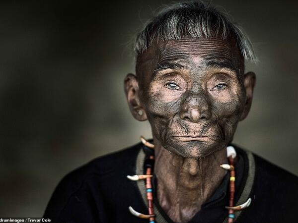 A tribesman wears an ornate necklace made of animal teeth and beads. (Mediadrumimages/ Trevor Cole)
