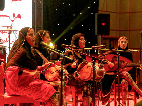 Members of the Iranian all-women music band "Dingo" (L to R) Malihe Shahinzadeh, Negin Heydari, Faezeh Mohseni, and Noushin Yousefzadeh perform together at a concert during the state-organised "Persian Gulf music" festival at Avini Hall in Iran's southern Gulf port city of Bandar Abbas on April 29, 2019. ATTA KENARE / AFP