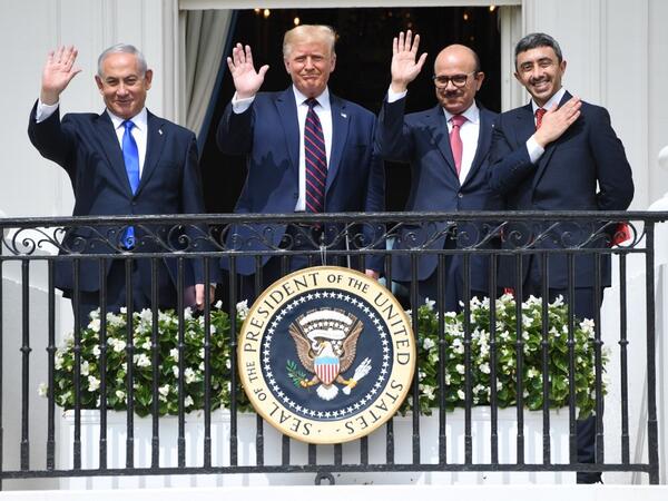 (L-R) Israeli Prime Minister Benjamin Netanyahu, US President Donald Trump, Bahrain Foreign Minister Abdullatif al-Zayani, and UAE Foreign Minister Abdullah bin Zayed Al-Nahyan wave from the Truman Balcony at the White House after they participated in the signing of the Abraham Accords where the countries of Bahrain and the United Arab Emirates recognize Israel, in Washington, DC, September 15, 2020. 