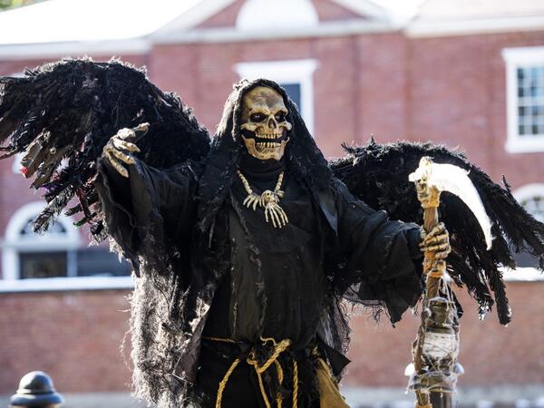Costumed revelers walk the city streets on Halloween in Salem, Massachusetts, on October 31, 2020. Salem canceled all official Halloween events and called for the city wide shutdown of all businesses at 20h00EDT (24H00GMT) in an effort to control the spread of Covid-19 and detour tourist from visiting Salem, a favorite of Halloween fans. Joseph Prezioso / AFP