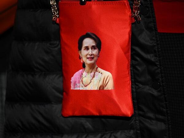 A portrait of Myanmar's de facto leader Aung San Suu Kyi is seen on a bag as Myanmar activists protest outside the United Nations university building in Tokyo on February 1, 2021 following a military coup in the country by a general after arresting civilian leader Aung San Suu Kyi and other senior officials. Philip FONG / AFP