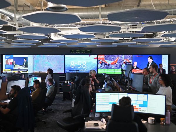 Members of staff work on computers in the Network Control Room inside Easyjet's new operations Integrated Control Centre (ICC) in Luton, north of London on May 22, 2024. A cutting-edge facility featuring artificial intelligence (AI) -- Easyjet's new control centre is tasked with handling about 2,000 mostly-European flights per day as the British airline eyes record summer demand. (Photo by Justin TALLIS / AFP)