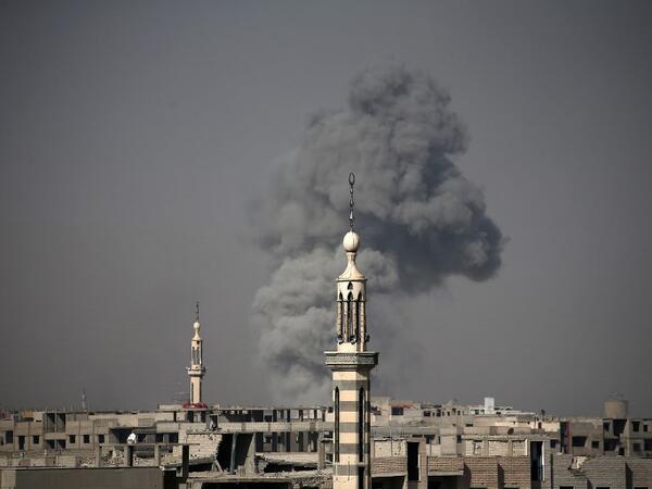 Smoke billows following Syrian government bombardment on the rebel-controlled town of Arbin, in the besieged Eastern Ghouta region on the outskirts of the capital Damascus on Mar. 12, 2018. 
(ABDULMONAM EASSA / AFP)