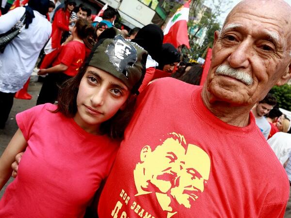 Supporters of the Lebanese Communist Party take part in a rally celebrating the International Labour Day in the Lebanese capital Beirut on May 1, 2018 / AFP