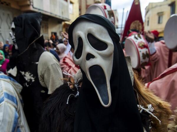 Young Moroccans take part in the Boujloud festival, a popular festival also known as the 'Moroccan Halloween' in the Sidi Moussa district of Sale near Rabat, on October 27, 2018. 
FADEL SENNA / AFP