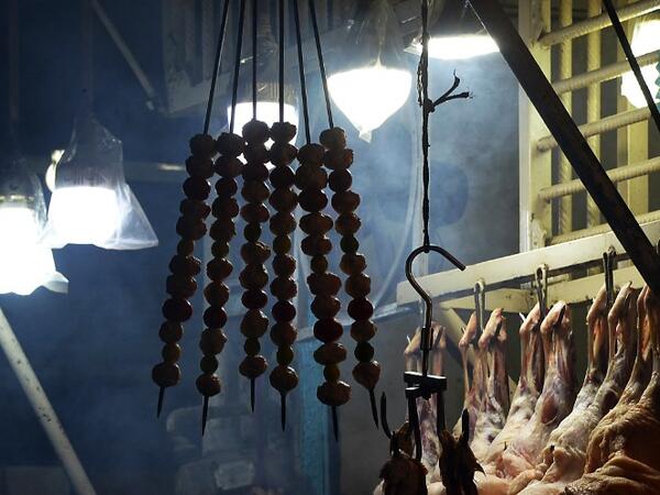 Skewers of lamb hang at a Charsi (Hashish) Tikka restaurant in Namak Mandi in Peshawar.
ABDUL MAJEED / AFP