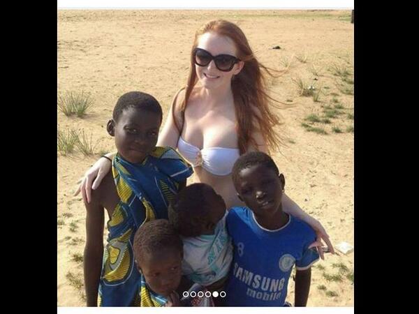 near naked woman with refugee children