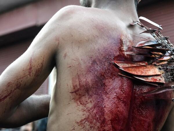 A Kashmiri Shiite Muslim mourner flagellates himself during a religious procession held on the seventh day of Ashura which remembers the slaying of the Prophet Muhammed's grandson in southern Iraq in the seventh century, in Srinagar on September 18, 2018. TAUSEEF MUSTAFA / AFP