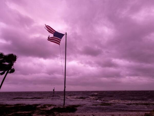 An American flag battered by Hurricane Michael continues to fly in the in the rose colored light of sunset at Shell Point Beach on October 10, 2018 in Crawfordville, Florida. (Mark Wallheiser/Getty Images/AFP)