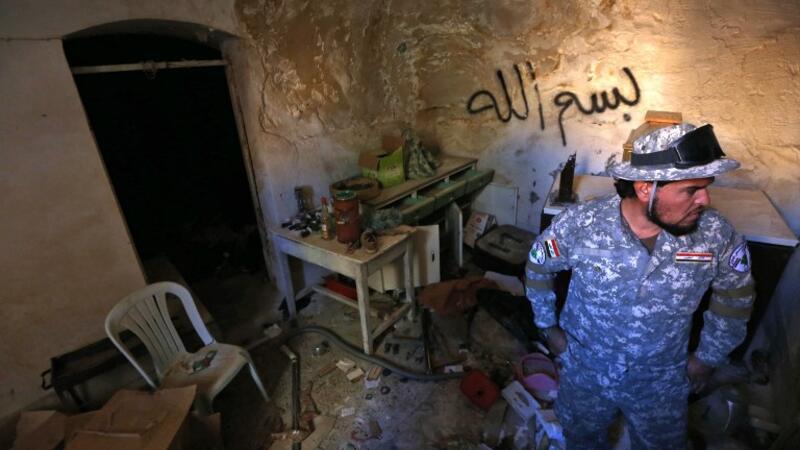 A Christian PMU soldier stands in a newly-liberated Catholic Monastery, southeast of Mosul (Safin Hamed/AFP)
