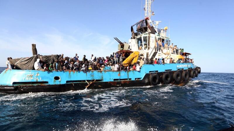 African migrants are rescued by a boat off the coat of Libya after attempting to cross the Mediterranean to Italy. (AFP/File)