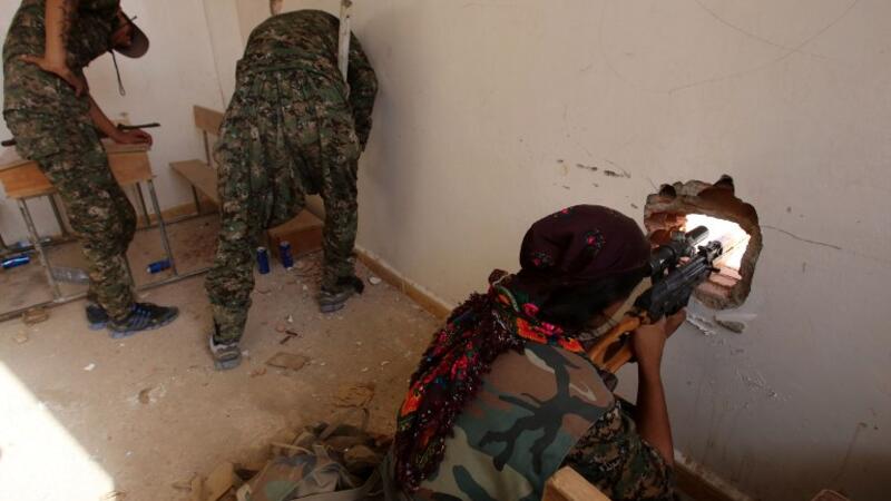 Kurdish forces position themselves inside a classroom on July 16, 2015. (AFP/File)