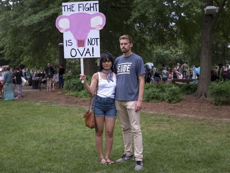 Cristina Castor (L) and Julian Kersh pose for a portrait in Ingram Park in Birmingham, Alabama, May 19, 2019 during the March for Reproductive Freedom. "If this goes all the way and flips Roe v Wade at that point it just seems like where is this going to stop," Kersh said. Seth HERALD / AFP