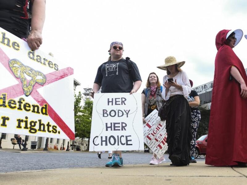 Protestors prepare to participate in a rally against one of the nation's most restrictive bans on abortions on May 19, 2019 in Montgomery, Alabama. Julie Bennett/Getty Images/AFP