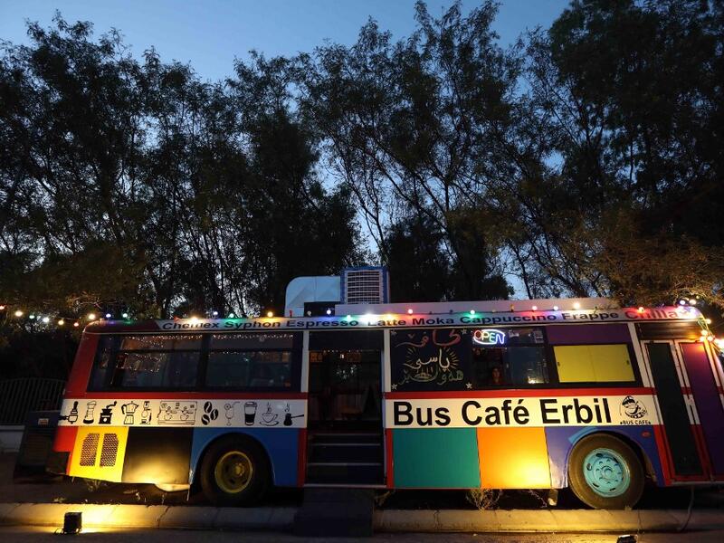 A picture taken late on June 7, 2019 shows "The Bus Cafe Erbil" in Arbil, the capital of Iraq's Kurdish autonomous region, on the long weekend of the Eid al-Fitr holiday which marks the end of the Muslim holy month of Ramadan.  SAFIN HAMED / AFP