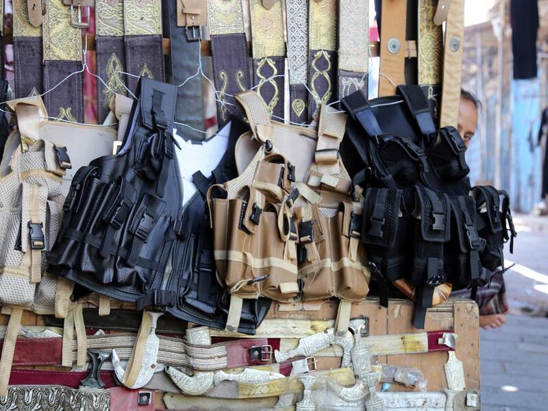 Tactical vests are pictured on display at a shop in Yemen's third city of Taez, on July 13, 2019. Before the war, the old market of Taez was crowded with people and was full of handcrafts and artisanal goods. AHMAD AL-BASHA / AFP
